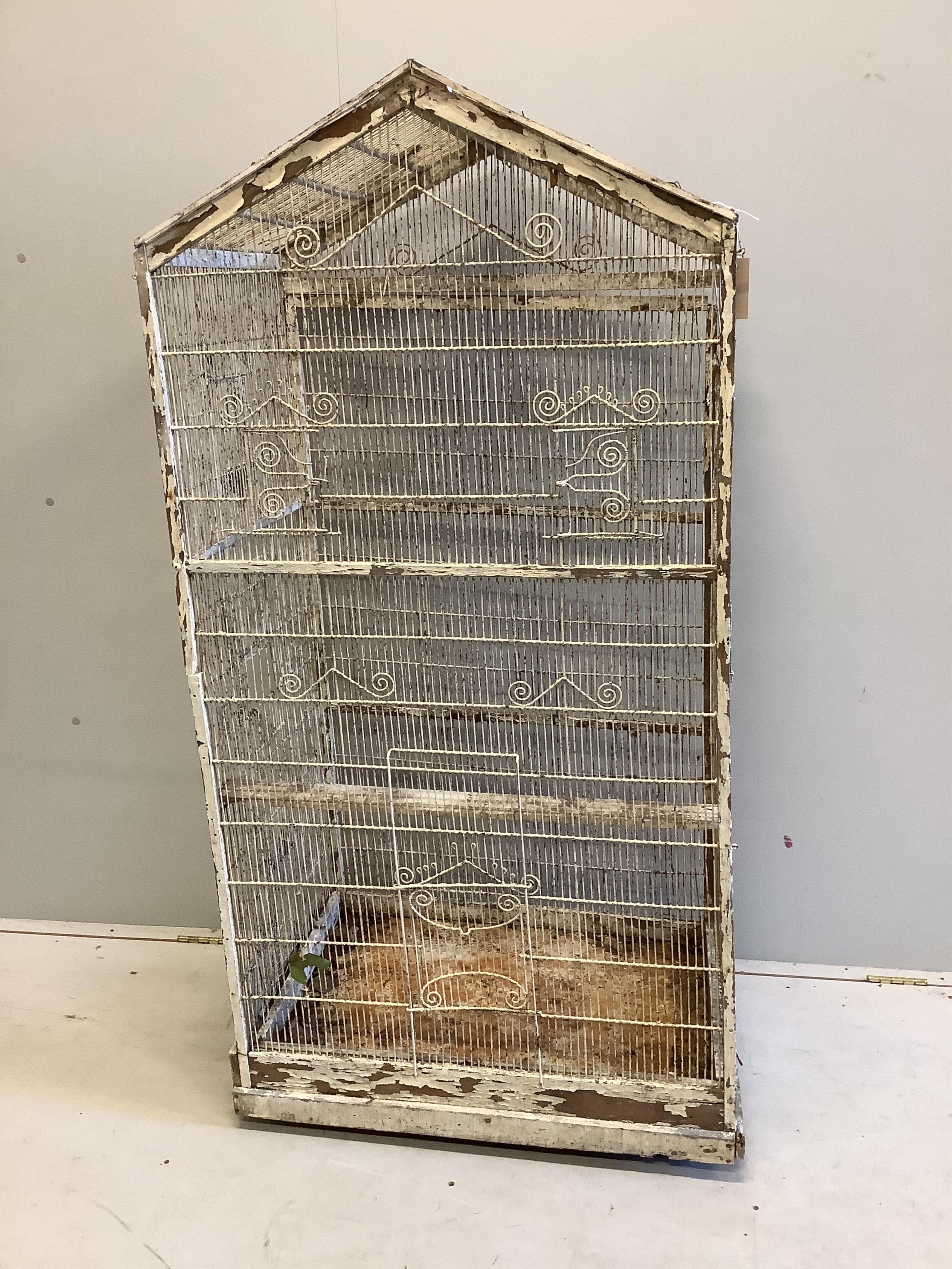 A large vintage wirework birdcage, width 75cm, depth 50cm, height 152cm. Condition - poor